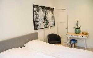 Appartement Beauvilliers tesisinde bir odada yatak veya yataklar