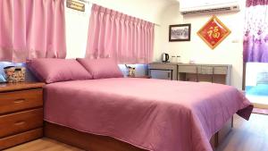 Postel nebo postele na pokoji v ubytování Da Yi Train Homestay