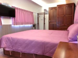 Postel nebo postele na pokoji v ubytování Da Yi Train Homestay
