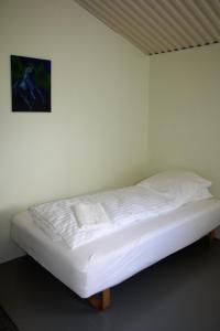 Postel nebo postele na pokoji v ubytování Kaldbakur Guesthouse