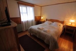 Rúm í herbergi á Hotel Mi Casa