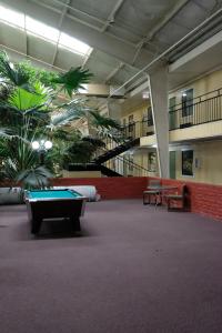 a room with a pool table in a building at Econo Lodge Elk City in Elk City