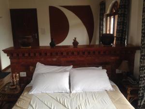 Uma cama ou camas num quarto em Vardan Resort n' Apartment