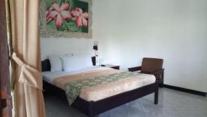 Postel nebo postele na pokoji v ubytování De Puspa Residence Seminyak