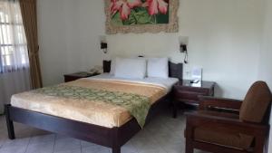 Postel nebo postele na pokoji v ubytování De Puspa Residence Seminyak