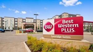 a sign that reads best western plus in a parking lot at Best Western Plus Sawridge Suites in Fort McMurray
