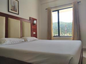Postel nebo postele na pokoji v ubytování Hotel Sandra Palace