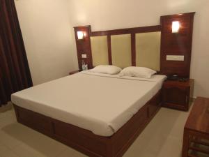 Postel nebo postele na pokoji v ubytování Hotel Sandra Palace