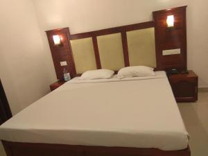 Postel nebo postele na pokoji v ubytování Hotel Sandra Palace