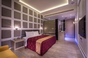 Giường trong phòng chung tại OUGE Boutique Motel - Pingtung