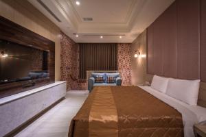 Postel nebo postele na pokoji v ubytování OUGE Boutique Motel - Pingtung