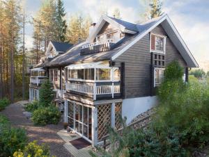 a house with a wrap around porch and a deck at Vuokatin Aateli Herttuatar in Vuokatti