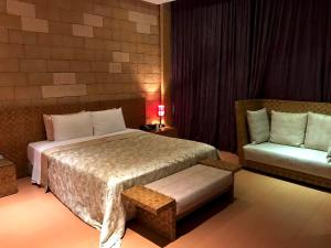 Postel nebo postele na pokoji v ubytování Fortune Villa Motel