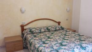 En eller flere senge i et værelse på Albergo Ristorante Lavedo