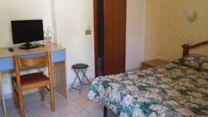מיטה או מיטות בחדר ב-Albergo Ristorante Lavedo