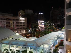 a view of a city at night with buildings at Hotel Abest Naha Kokusai Street in Naha