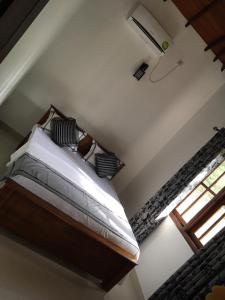 Postel nebo postele na pokoji v ubytování Aroma Villa Homestay