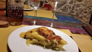 a piece of food on a white plate on a table at Residenza d'Epoca Borgodifiume in Fiumefreddo Bruzio