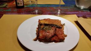 a piece of cake on a white plate on a table at Residenza d'Epoca Borgodifiume in Fiumefreddo Bruzio
