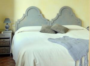 Postel nebo postele na pokoji v ubytování Agriturismo Borgo San Francesco