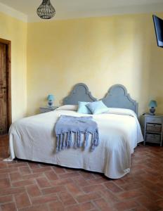 Postel nebo postele na pokoji v ubytování Agriturismo Borgo San Francesco
