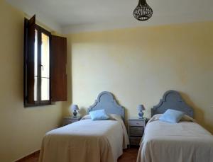 Postel nebo postele na pokoji v ubytování Agriturismo Borgo San Francesco
