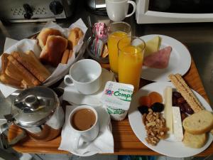 a table topped with plates of breakfast foods and drinks at Semeli Hotel in Athens +37 photos