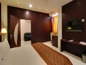 Voodi või voodid majutusasutuse Hotel Sai Jashan Shirdi - Where blessings & comfort meet toas