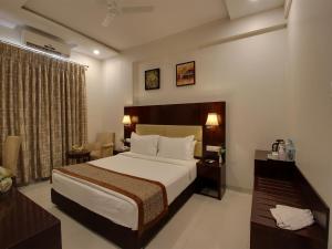 Voodi või voodid majutusasutuse Hotel Sai Jashan Shirdi - Where blessings & comfort meet toas