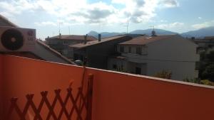 a view of a balcony of a house with a roof at L'abete in Guspini