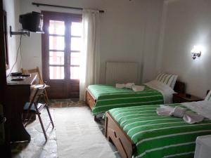 Letto o letti in una camera di Guesthouse Ariadni