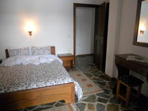 Letto o letti in una camera di Guesthouse Ariadni