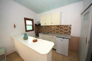 a kitchen with a white counter top in a room at Amalia Studios in Skiathos