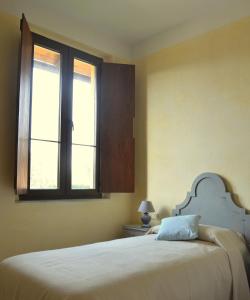Postel nebo postele na pokoji v ubytování Agriturismo Borgo San Francesco