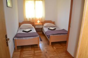 Postel nebo postele na pokoji v ubytování Apartments Marina
