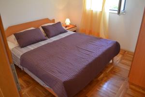 Postel nebo postele na pokoji v ubytování Apartments Marina