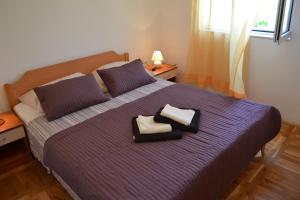 Postel nebo postele na pokoji v ubytování Apartments Marina