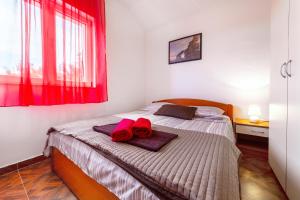 Postel nebo postele na pokoji v ubytování Apartments Marina