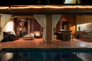 a living room with a pool in the middle of it at Bohemian House - Pretoria in Pretoria
