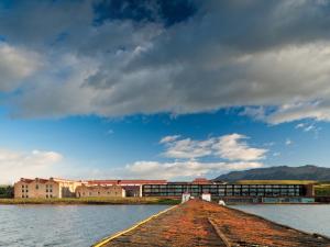 a dock in the middle of a body of water at The Singular Patagonia Hotel in Puerto Natales