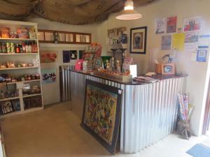 a shop with a counter in a room at DeKotzenhof in Wakkerstroom