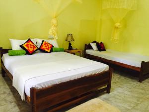 Krevet ili kreveti u jedinici u okviru objekta Sigiri Rainbow Lodge