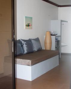 a bed in a room with at Positano Alona Beach Panglao in Panglao