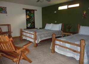 Postel nebo postele na pokoji v ubytování Pura Vida Hotel