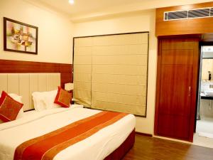 Ένα ή περισσότερα κρεβάτια σε δωμάτιο στο Hotel Tridev