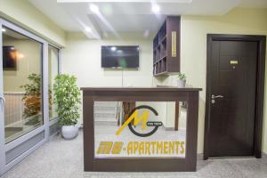 TV a/nebo společenská místnost v ubytování Apartmani MG