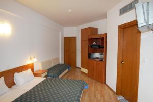 Postel nebo postele na pokoji v ubytování Hotel Filoxenia Beach