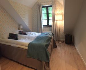 Postel nebo postele na pokoji v ubytování Hotell Eikerapen Gjestegård Åseral
