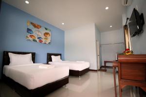 Postel nebo postele na pokoji v ubytování Khaohom Resort