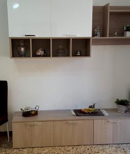 a kitchen with a wooden counter top and cabinets at Borgo Saraceno in Sambuca di Sicilia